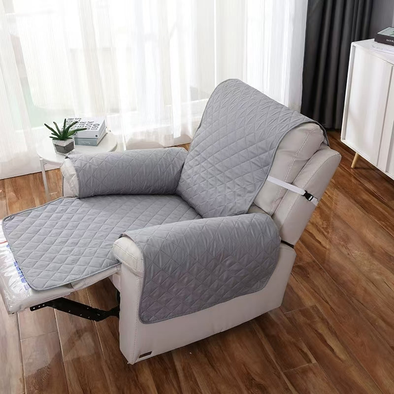 Protection canapé gris vide sur fauteuil  inclinable blanc 